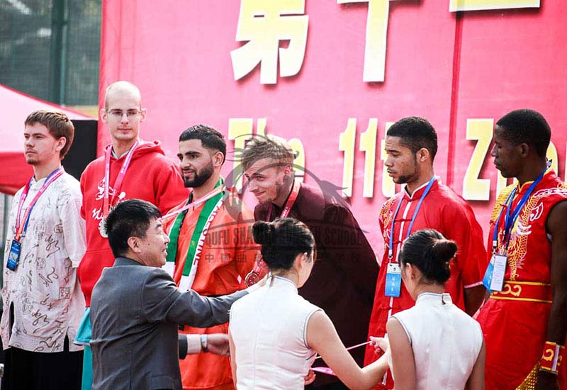 Students recieving kung fu medals