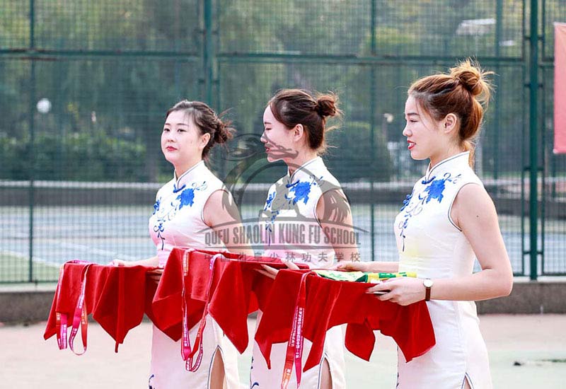 chinese gilrs giving medals