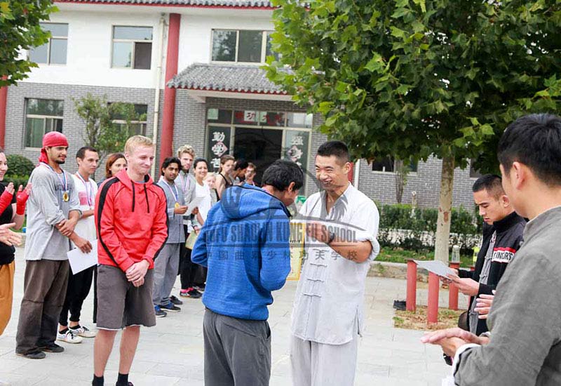 master giving a medal