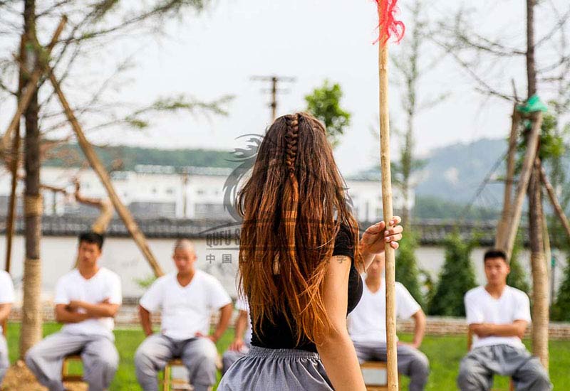 warrior girl training spear kung fu school